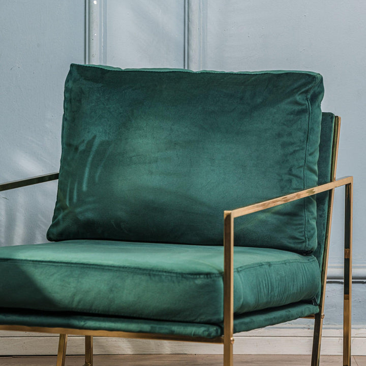 Armchair in metal and velvet green