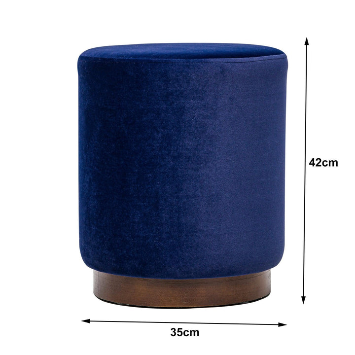 Blue velvet pouf with wooden base